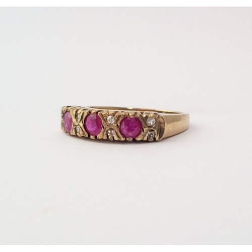 198 - AN ANTIQUE 9CT YELLOW GOLD 11 STONE RUBY & DIAMOND RING, with three round cut rubies and two diamond... 