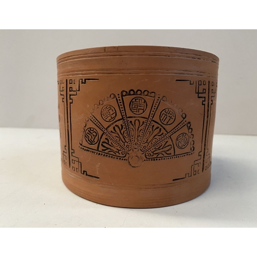 199 - A PAIR OF CHINESE RED CLAY CANNISTERS, cylindrical form, the sides decorated with panels depicting f... 