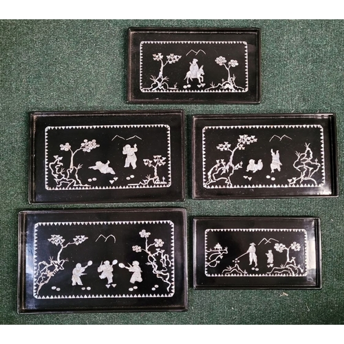 207 - A SET OF FIVE VINTAGE LACQUER & MOTHER OF PEARL INLAID TRAYS of graduating sizes, each depicting fig... 