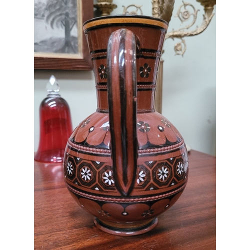 209 - TWO EARTHENWARE HAND PAINTED & GLAZED JUGS, (i) A lovely brown earthenware jug, with floral decorati... 