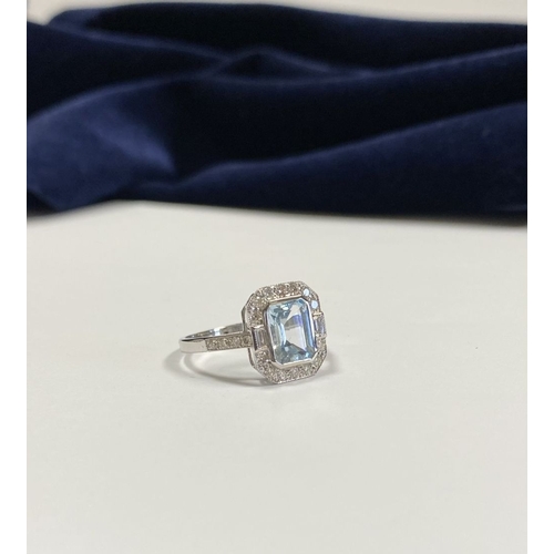 21 - AN 18CT WHITE GOLD AQUAMARINE & DIAMOND RING, with central emerald cut aquamarine, weight: 1.12cts, ... 