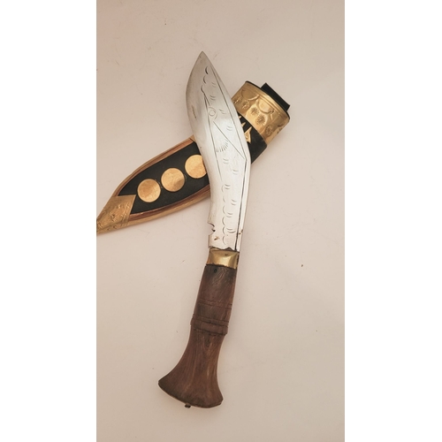 214 - A CONTEMPORY NEPALESE KUKRI GURKHA STYLE KNIFE, in sheath. The leather sheath with brass decorations... 