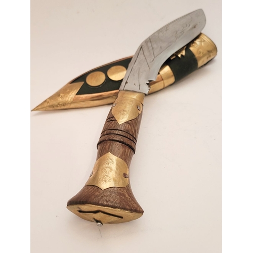 214 - A CONTEMPORY NEPALESE KUKRI GURKHA STYLE KNIFE, in sheath. The leather sheath with brass decorations... 