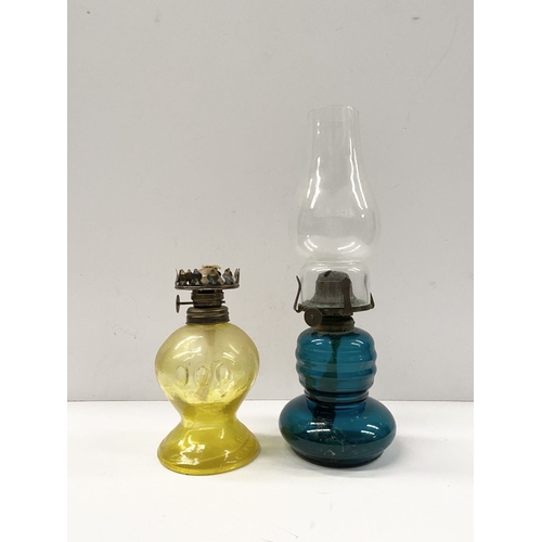 218 - TWO VINTAGE YELLOW & BLUE GLASS OIL LAMPS, (i) blue glass lamp reading ‘British Made’ to burner, com... 