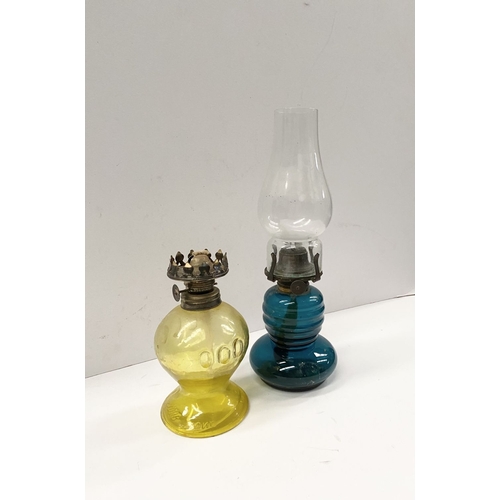 218 - TWO VINTAGE YELLOW & BLUE GLASS OIL LAMPS, (i) blue glass lamp reading ‘British Made’ to burner, com... 