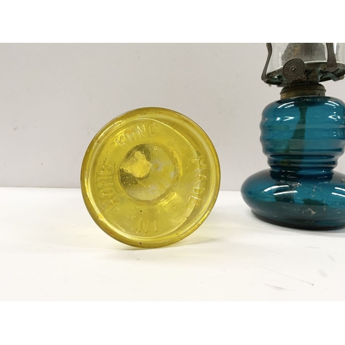 218 - TWO VINTAGE YELLOW & BLUE GLASS OIL LAMPS, (i) blue glass lamp reading ‘British Made’ to burner, com... 