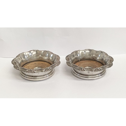 219 - A FINE PAIR OF ANTIQUE CONTINENTAL SILVER WINE COASTERS, Makers marks slightly rubbed, possibly Germ... 