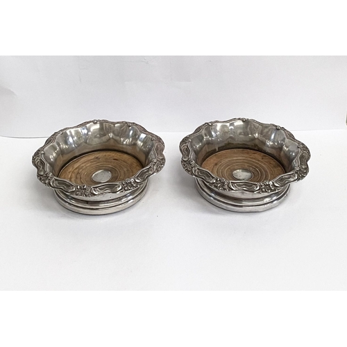 219 - A FINE PAIR OF ANTIQUE CONTINENTAL SILVER WINE COASTERS, Makers marks slightly rubbed, possibly Germ... 