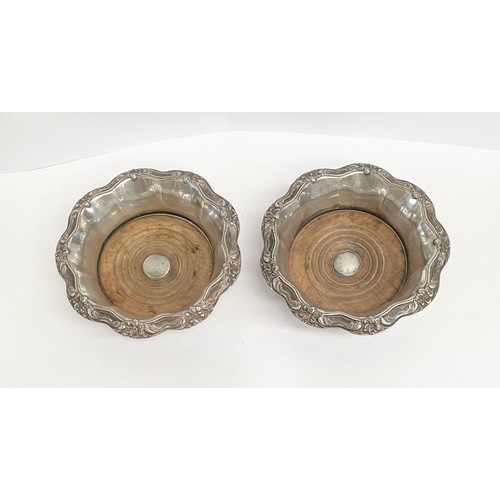 219 - A FINE PAIR OF ANTIQUE CONTINENTAL SILVER WINE COASTERS, Makers marks slightly rubbed, possibly Germ... 