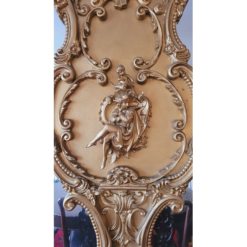 225 - AN EXCEPTIONAL DOUBLE PANE GILT OVER MANTLE, with raised relief panel to the centre depicting a seat... 