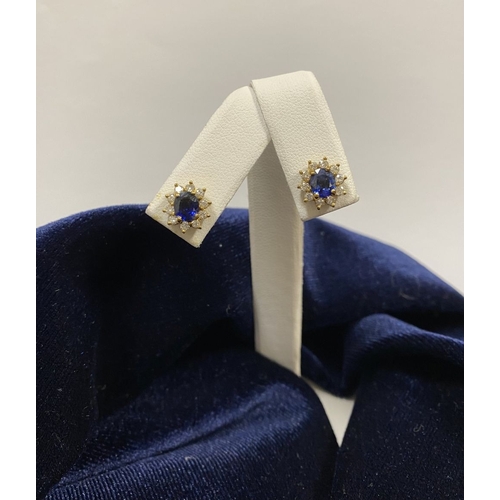 24 - A BEAUTIFUL PAIR OF SAPPHIRE & DIAMOND CLUSTER STUD EARRINGS, with central oval cut vibrant sapphire... 