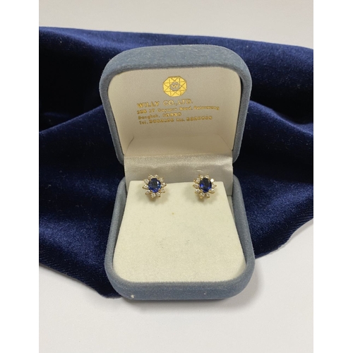 24 - A BEAUTIFUL PAIR OF SAPPHIRE & DIAMOND CLUSTER STUD EARRINGS, with central oval cut vibrant sapphire... 