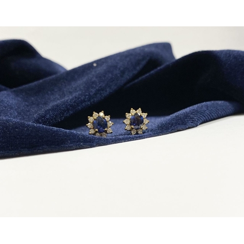 24 - A BEAUTIFUL PAIR OF SAPPHIRE & DIAMOND CLUSTER STUD EARRINGS, with central oval cut vibrant sapphire... 