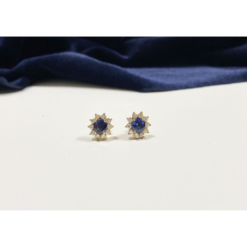 24 - A BEAUTIFUL PAIR OF SAPPHIRE & DIAMOND CLUSTER STUD EARRINGS, with central oval cut vibrant sapphire... 