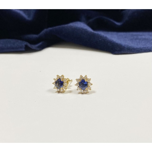 24 - A BEAUTIFUL PAIR OF SAPPHIRE & DIAMOND CLUSTER STUD EARRINGS, with central oval cut vibrant sapphire... 