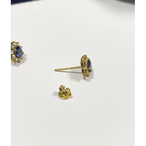 24 - A BEAUTIFUL PAIR OF SAPPHIRE & DIAMOND CLUSTER STUD EARRINGS, with central oval cut vibrant sapphire... 