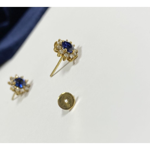 24 - A BEAUTIFUL PAIR OF SAPPHIRE & DIAMOND CLUSTER STUD EARRINGS, with central oval cut vibrant sapphire... 