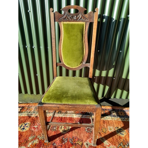 254 - AN EDWARDIAN DINING CHAIR, with carved back rail, upholstered backrest and seat, raised on tapered l... 