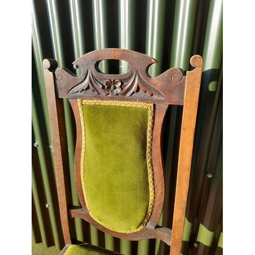 254 - AN EDWARDIAN DINING CHAIR, with carved back rail, upholstered backrest and seat, raised on tapered l... 