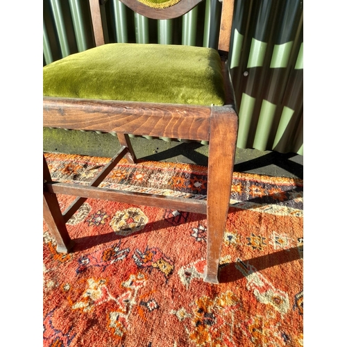 254 - AN EDWARDIAN DINING CHAIR, with carved back rail, upholstered backrest and seat, raised on tapered l... 