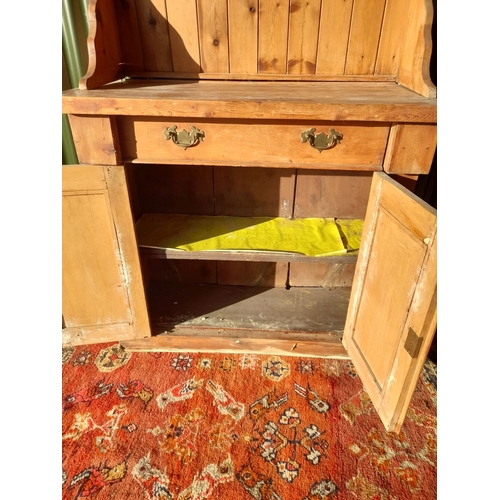 259 - A WELSH MADE ANTIQUE PINE DRESSER, with open shelves to top above base with one drawer over two door... 