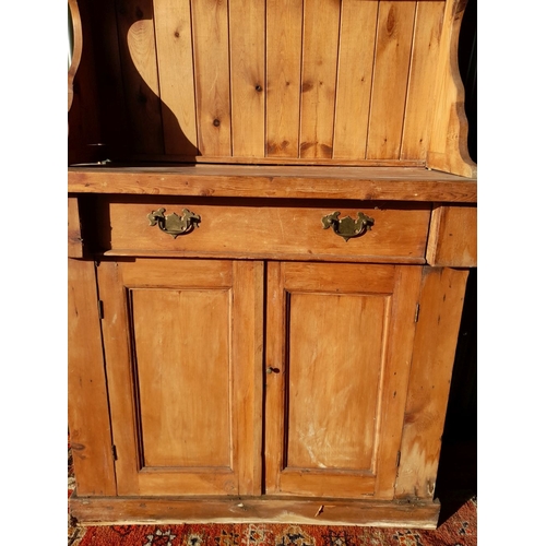 259 - A WELSH MADE ANTIQUE PINE DRESSER, with open shelves to top above base with one drawer over two door... 