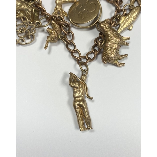 26 - A BEAUTIFUL 9CT YELLOW GOLD CHARM BRACELET, the chain is 9ct gold marked 375, with a wonderful array... 