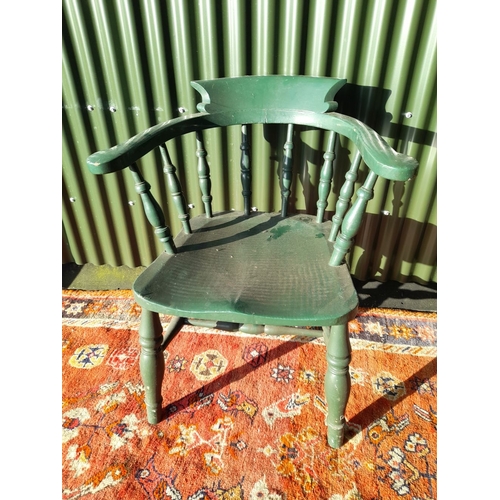 260 - AN ANTIQUE SOLID PINE PAINTED CAPTAINS CHAIR, with curved backrail raised on carved spindles. The se... 