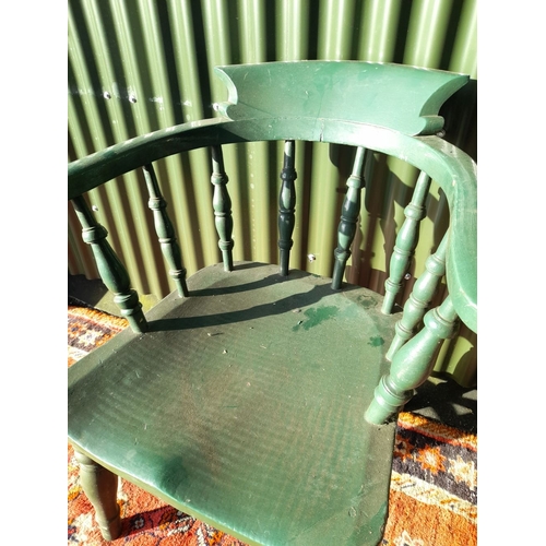 260 - AN ANTIQUE SOLID PINE PAINTED CAPTAINS CHAIR, with curved backrail raised on carved spindles. The se... 