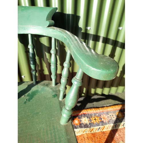 260 - AN ANTIQUE SOLID PINE PAINTED CAPTAINS CHAIR, with curved backrail raised on carved spindles. The se... 