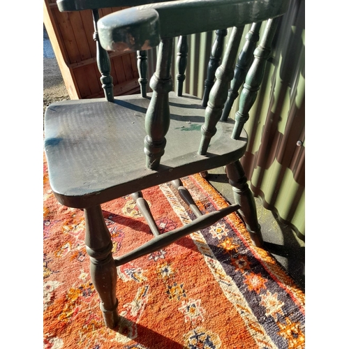 260 - AN ANTIQUE SOLID PINE PAINTED CAPTAINS CHAIR, with curved backrail raised on carved spindles. The se... 