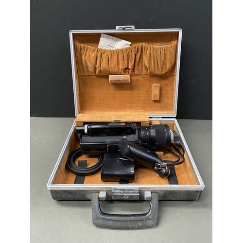 261 - A VINTAGE CASED ELMO SUPER 108 CAMERA, complete with lenses and attachments as photographed. ALONG W... 