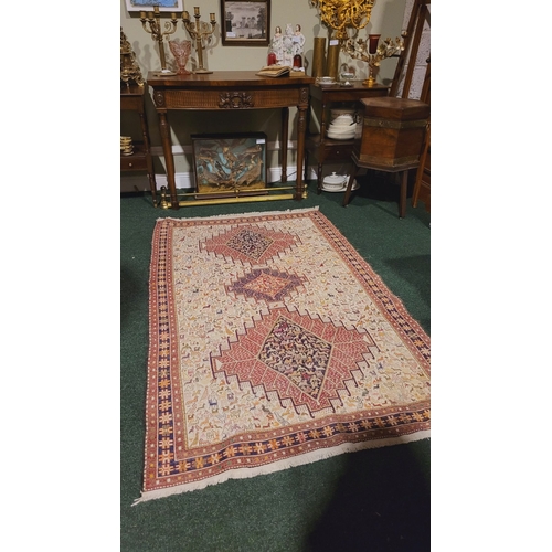 27 - A BEAUTIFUL HANDWOVEN IRANIAN KILIM FLOOR RUG, with a pair of large medallions one to each end with ... 