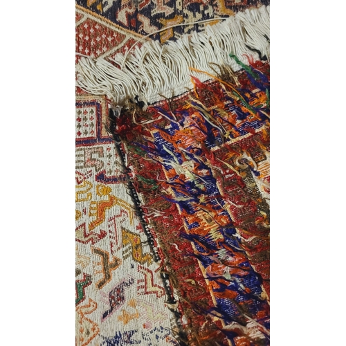 27 - A BEAUTIFUL HANDWOVEN IRANIAN KILIM FLOOR RUG, with a pair of large medallions one to each end with ... 