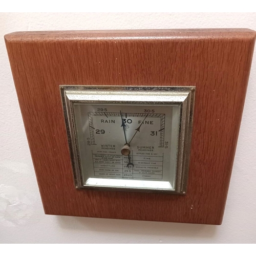 279 - A MID 20TH CENTURY ANEROID BAROMETER, in working order. Dimensions: 22cm x 22cm approx.