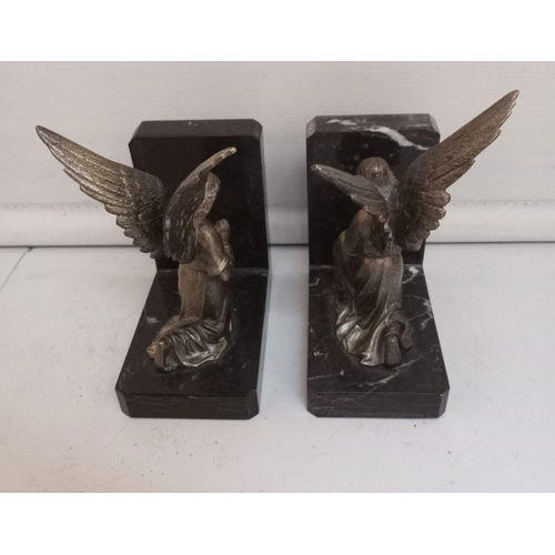 286 - A PAIR OF ART DECO PERIOD BOOKENDS, in the form of angels, on black marble bases. Dimensions: 12cm l... 