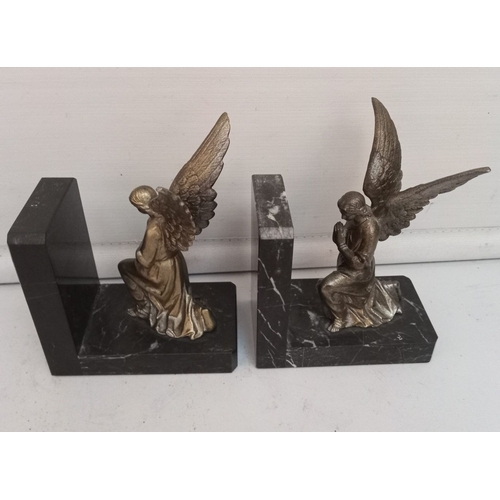 286 - A PAIR OF ART DECO PERIOD BOOKENDS, in the form of angels, on black marble bases. Dimensions: 12cm l... 