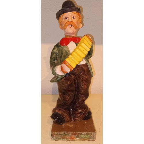 287 - A MID 20TH CENTURY CERAMIC NOVELTY DECANTER, in the form of man playing accordion, in excellent cond... 