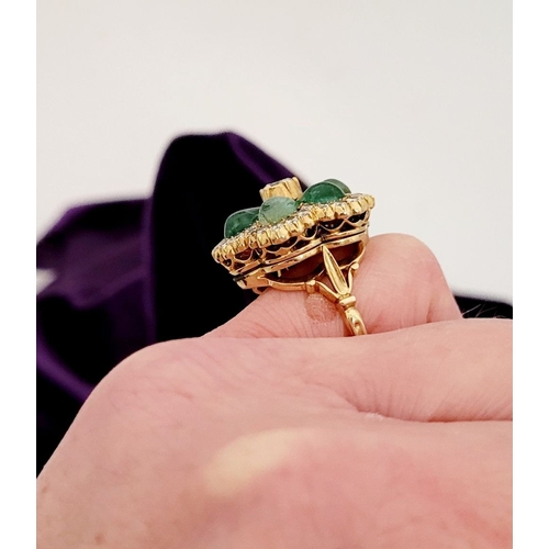 29 - AN 18CT YELLOW GOLD VINTAGE DIAMOND & EMERALD RING, the unique piece is in the form of a flower, wit... 