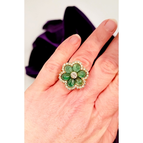 29 - AN 18CT YELLOW GOLD VINTAGE DIAMOND & EMERALD RING, the unique piece is in the form of a flower, wit... 