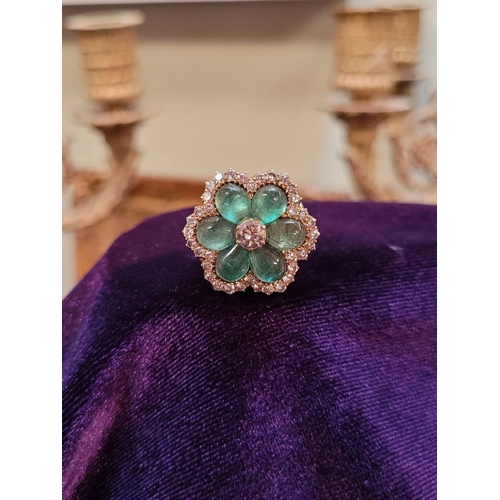 29 - AN 18CT YELLOW GOLD VINTAGE DIAMOND & EMERALD RING, the unique piece is in the form of a flower, wit... 