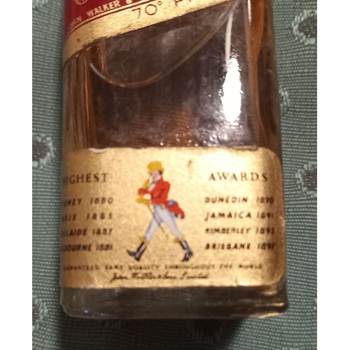 295 - A VINTAGE MINIATURE JOHNNIE WALKER RED LABEL WHISKY BOTTLE, complete with original box, seal intact