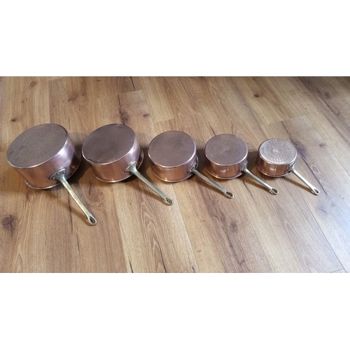 298 - A SET OF FIVE COPPER SAUCEPANS, graduating in size, the largest is 21cm diameter approx.