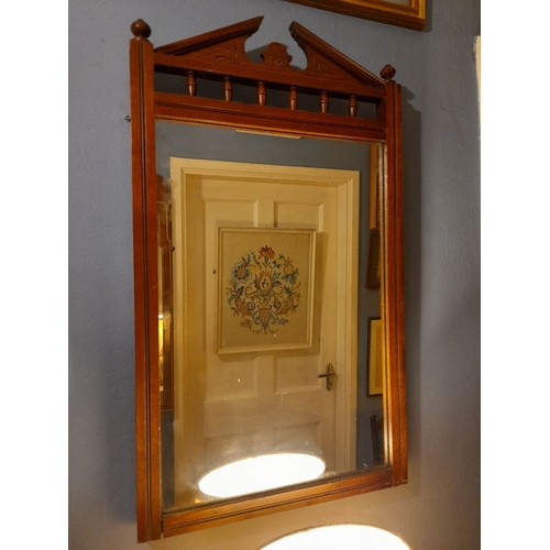 303 - A NICE ANTIQUE MAHOGANY MIRROR, rectangular mirror in carved frame with pediment to top, above row o... 