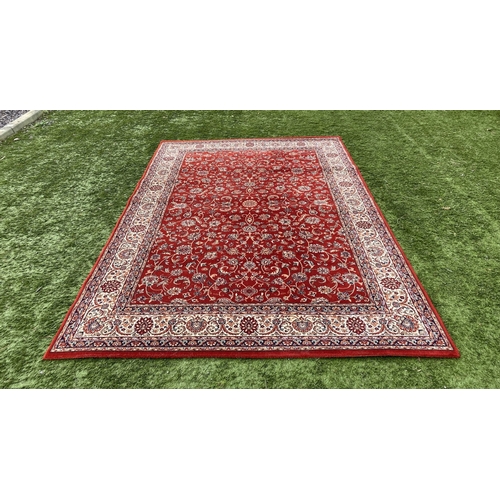 313 - A VIBRANT TURKISH STYLE RUG, excellent quality, the centre with foliate designs on red ground, surro... 