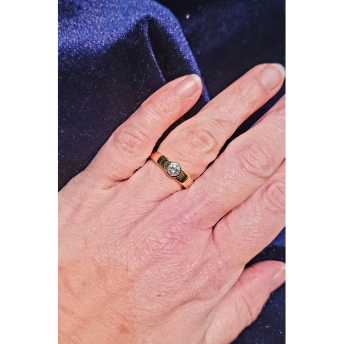 36 - A VINTAGE 18CT YELLOW GOLD SOLITAIRE RING, the bezel set ¼ carat diamond is held to the centre of th... 