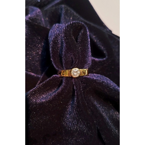 36 - A VINTAGE 18CT YELLOW GOLD SOLITAIRE RING, the bezel set ¼ carat diamond is held to the centre of th... 