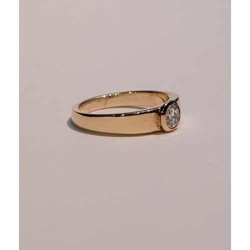 36 - A VINTAGE 18CT YELLOW GOLD SOLITAIRE RING, the bezel set ¼ carat diamond is held to the centre of th... 