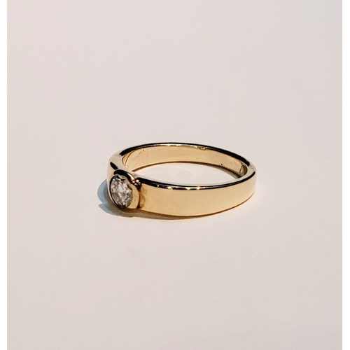 36 - A VINTAGE 18CT YELLOW GOLD SOLITAIRE RING, the bezel set ¼ carat diamond is held to the centre of th... 