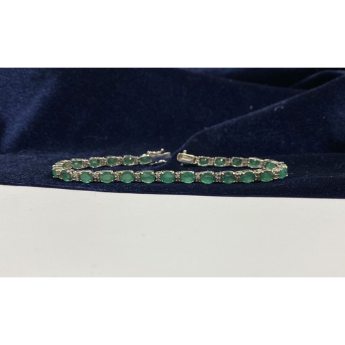 4 - AN 18CT WHITE GOLD EMERALD & DIAMOND TENNIS BRACELET, set with oval cut emeralds separated by two ro... 